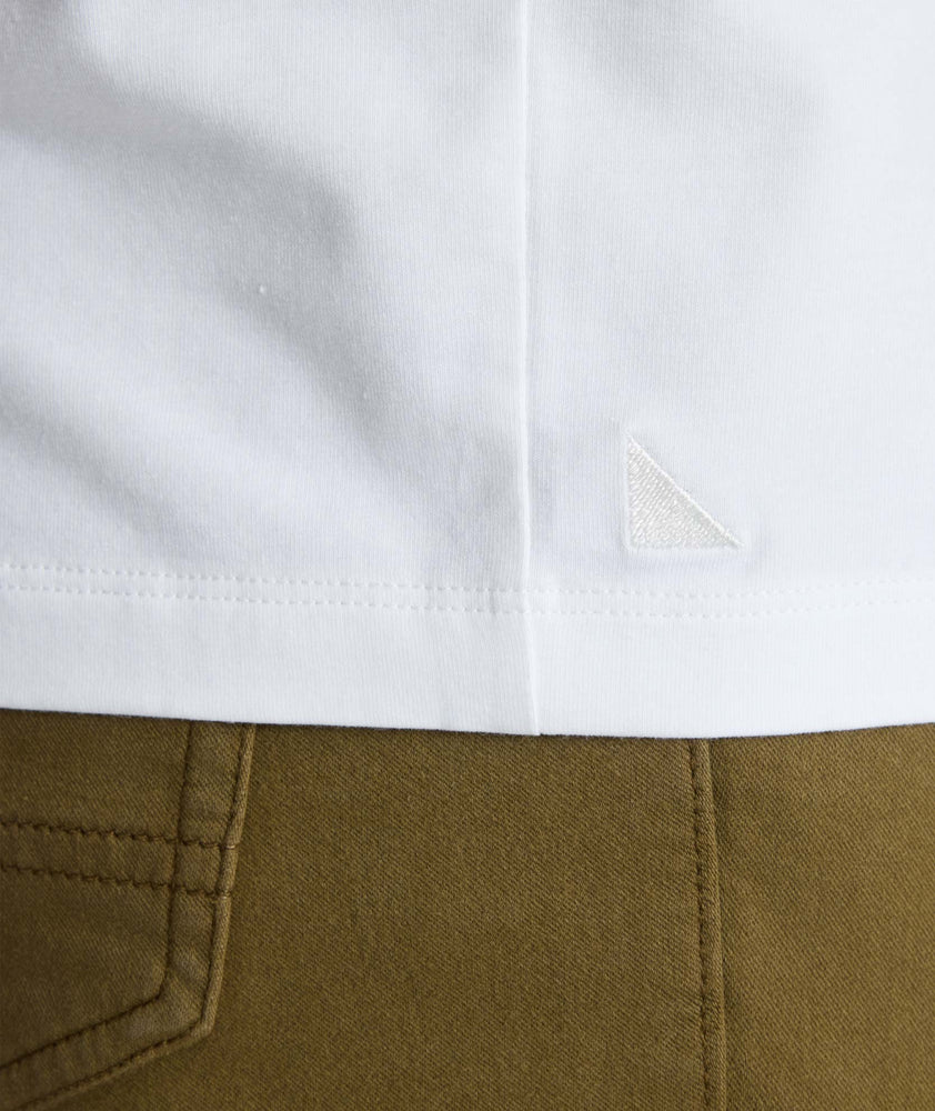 Model wearing a white short-sleeve henley