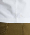 Model wearing a white short-sleeve henley