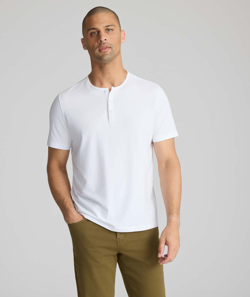 Model wearing a white short-sleeve henley