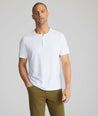 Model wearing a white short-sleeve henley
