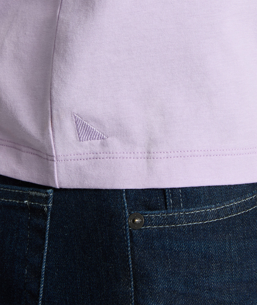 Model is wearing UNTUCKit glera tencel Lavendula henley. 