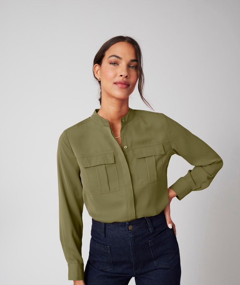 Model is wearing UNTUCKit Gloria shirt in olive.