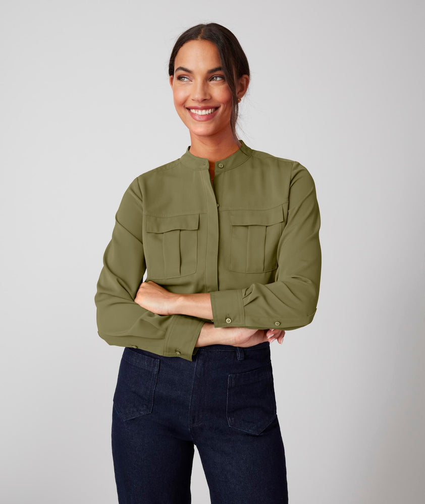 Model is wearing UNTUCKit Gloria shirt in olive.