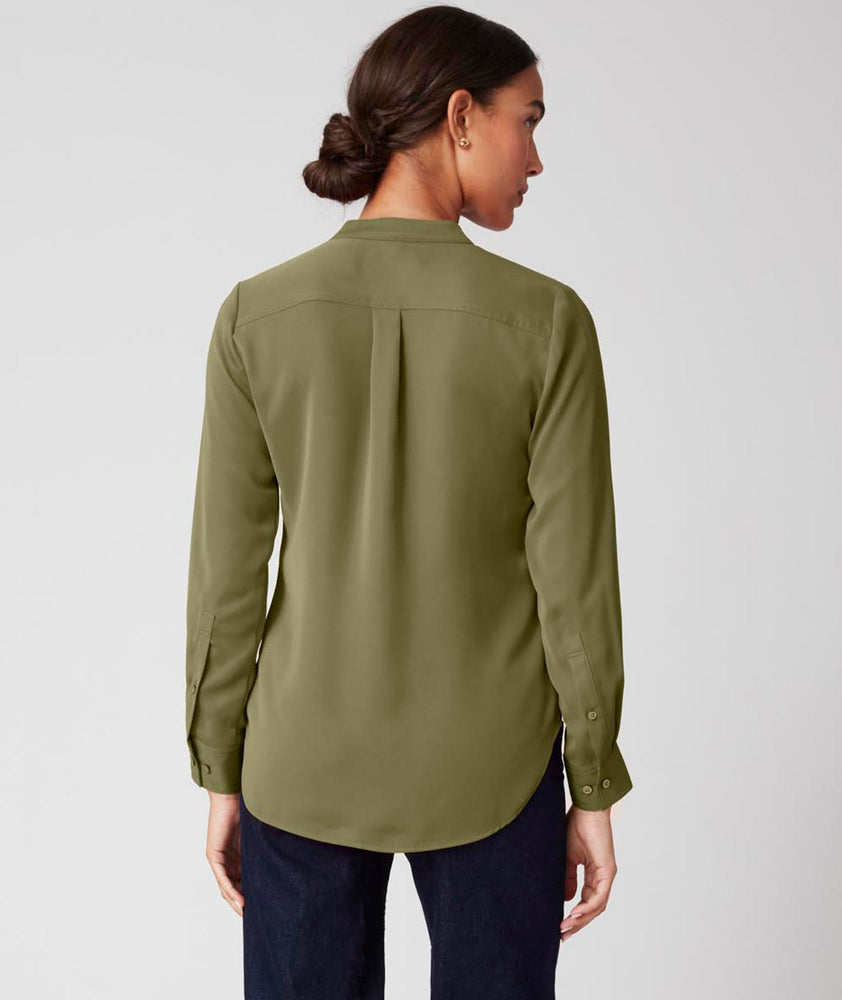 Model is wearing UNTUCKit Gloria shirt in olive.