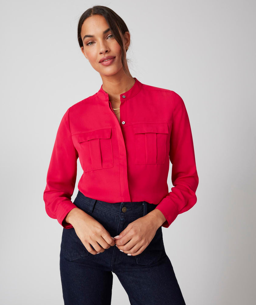 Model is wearing UNTUCKit Gloria shirt in red.