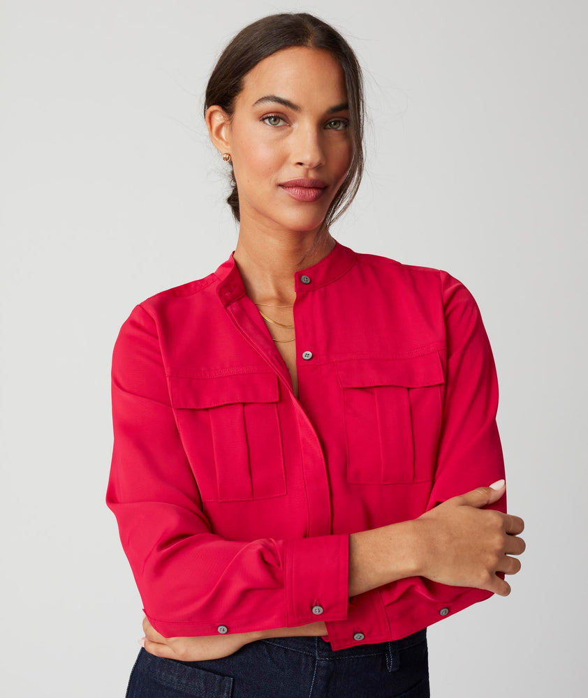 Model is wearing UNTUCKit Gloria shirt in red.