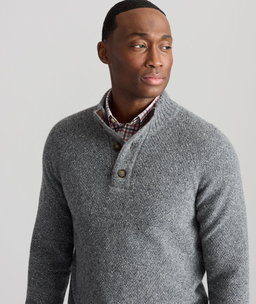 Model is wearing UNTUCKit Button-Neck Donegal Sweater in gray.