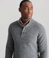 Model is wearing UNTUCKit Button-Neck Donegal Sweater in gray.