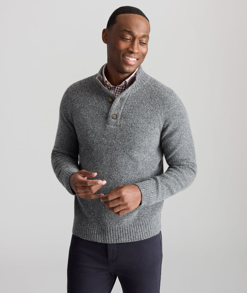 Model is wearing UNTUCKit Button-Neck Donegal Sweater in gray.