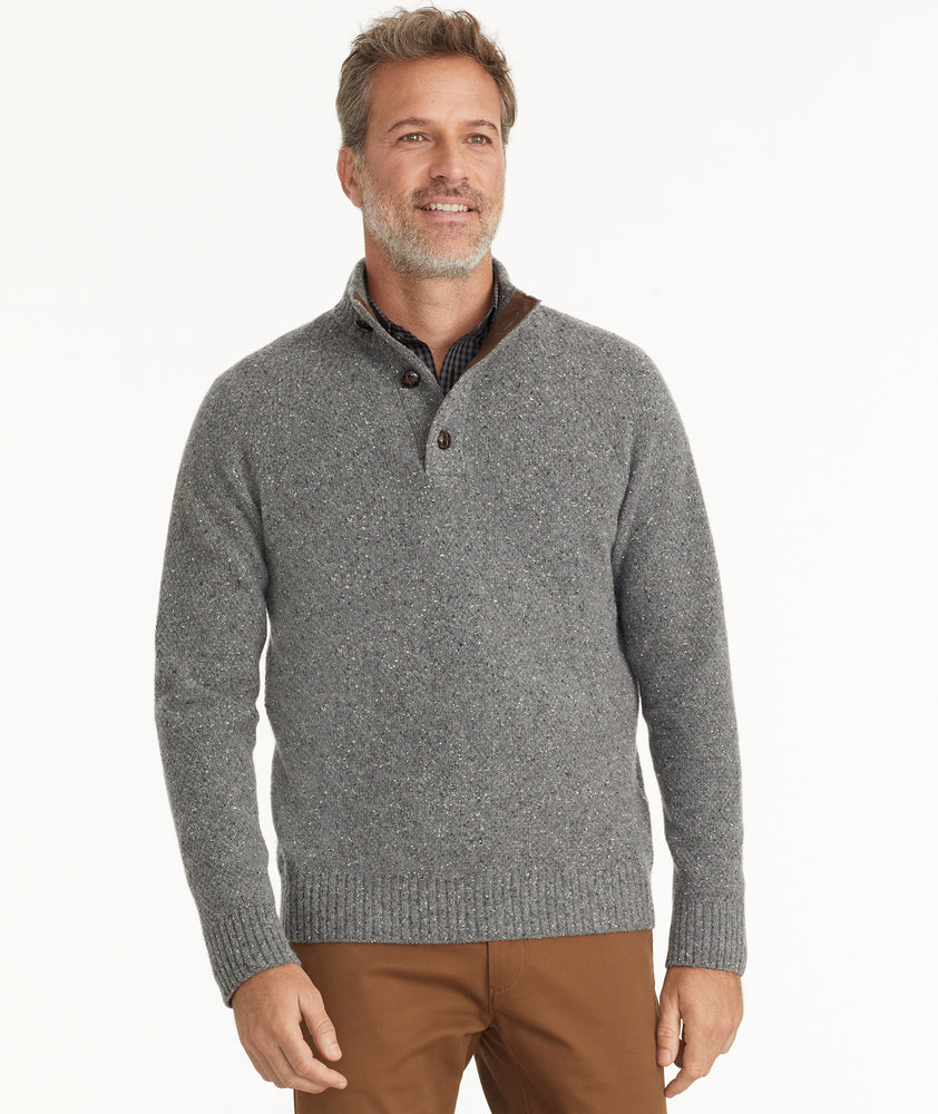 Model is wearing UNTUCKit Button-Neck Donegal Sweater in gray.
