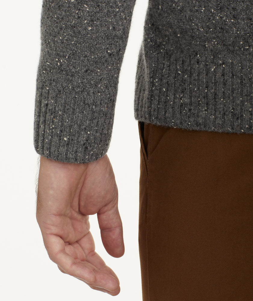 Model is wearing UNTUCKit Button-Neck Donegal Sweater in gray.