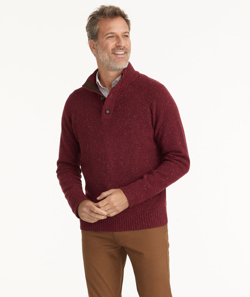 Model is wearing UNTUCKit Button-Neck Donegal Sweater in Burgundy.