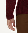 Model is wearing UNTUCKit Button-Neck Donegal Sweater in Burgundy.