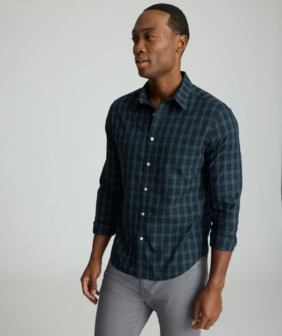 Model is wearing UNTUCKit Wrinkle-Free Grant Shirt in  Green & Navy Tartan.