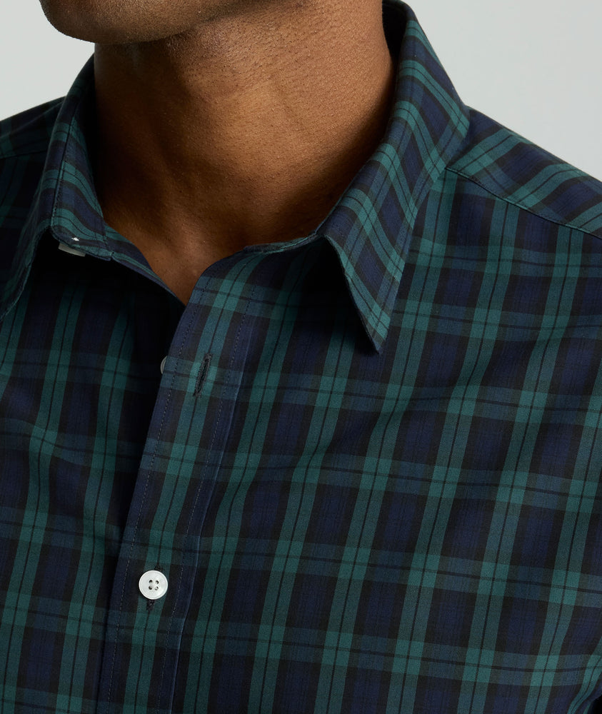 Model is wearing UNTUCKit Wrinkle-Free Grant Shirt in  Green & Navy Tartan.