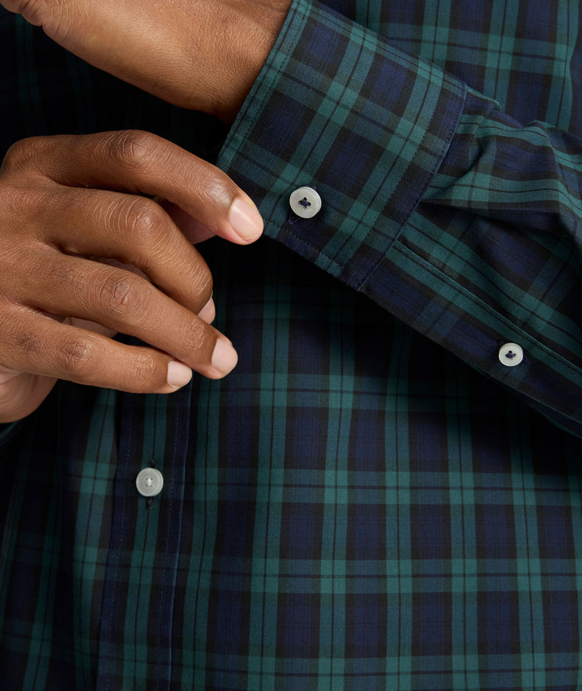Model is wearing UNTUCKit Wrinkle-Free Grant Shirt in  Green & Navy Tartan.