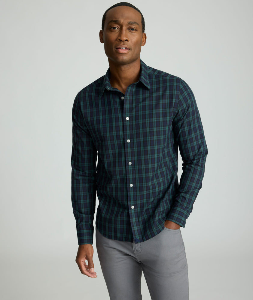 Model is wearing UNTUCKit Wrinkle-Free Grant Shirt in  Green & Navy Tartan.