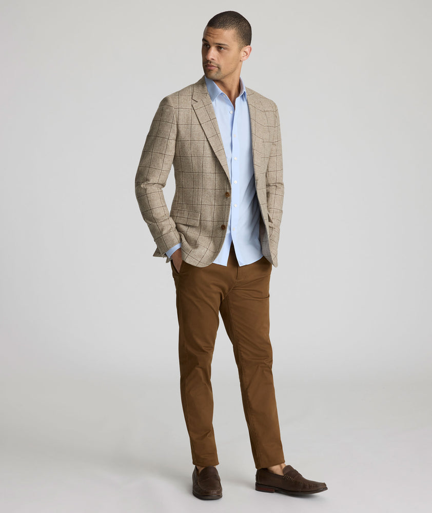 Model is wearing UNTICKit Italian Wool Blend Graydy Sport Coat in Tan Windowpane Check. 