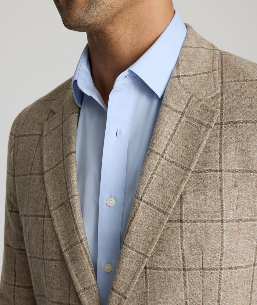 Model is wearing UNTICKit Italian Wool Blend Graydy Sport Coat in Tan Windowpane Check. 
