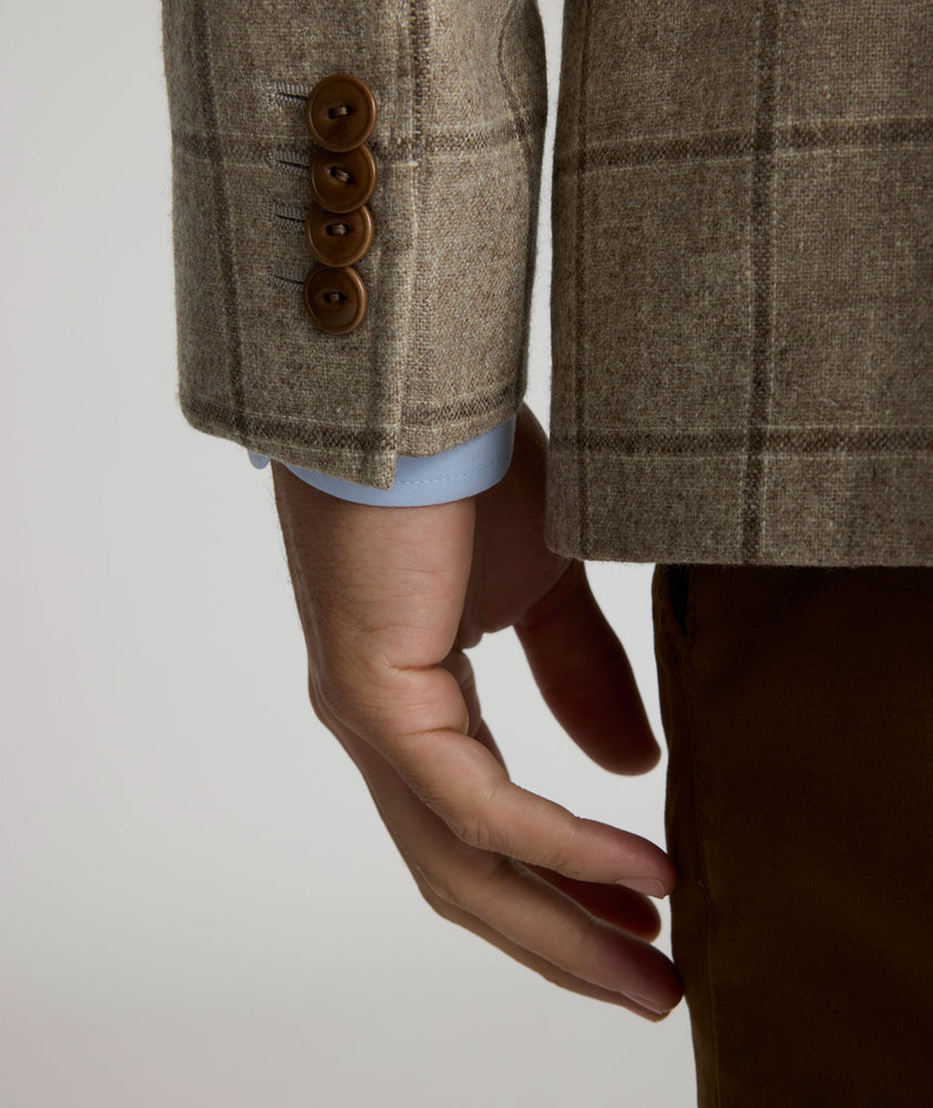 Model is wearing UNTICKit Italian Wool Blend Graydy Sport Coat in Tan Windowpane Check. 