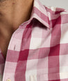 Model is wearing UNTUCKIt Greenwald Flannel in pink.