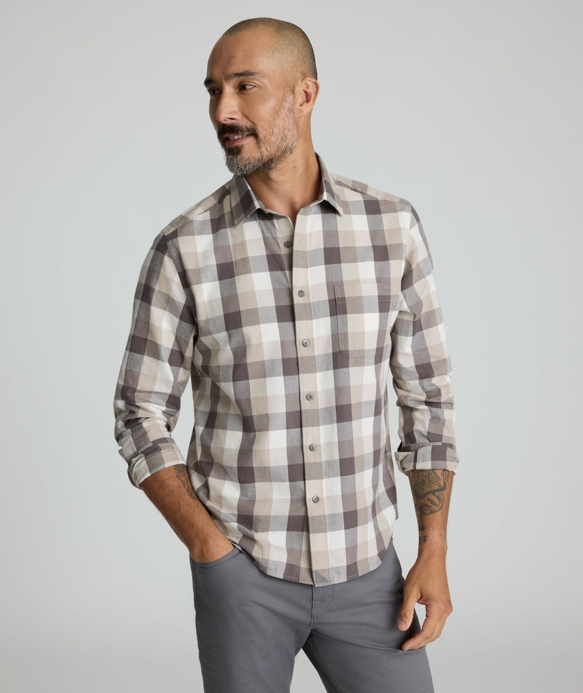 Model is wearing UNTUCKIt Greenwald Flannel in brown.