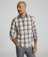 Model is wearing UNTUCKIt Greenwald Flannel in brown.