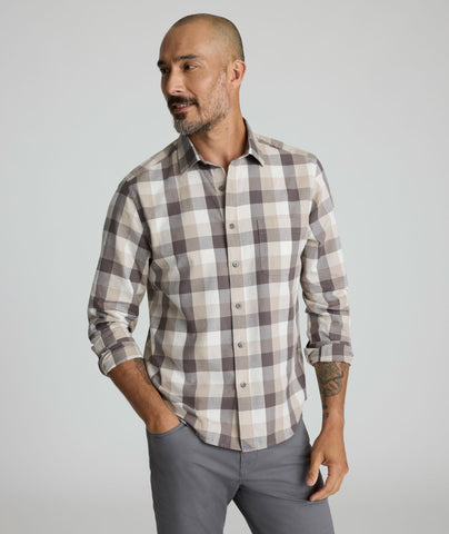 Model is wearing UNTUCKIt Greenwald Flannel in brown.