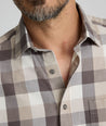 Model is wearing UNTUCKIt Greenwald Flannel in brown.