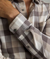 Model is wearing UNTUCKIt Greenwald Flannel in brown.