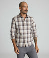 Model is wearing UNTUCKIt Greenwald Flannel in brown.