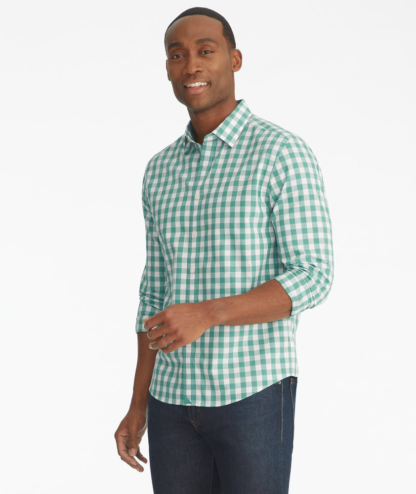 Model is wearing UNTUCKit Groppello green wrinkle free button down.