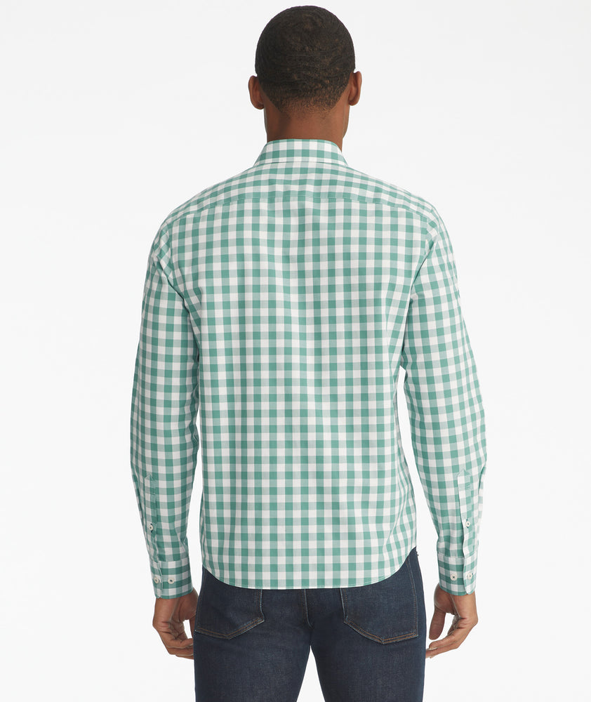 Model is wearing UNTUCKit Groppello green wrinkle free button down.