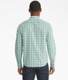 Model is wearing UNTUCKit Groppello green wrinkle free button down.