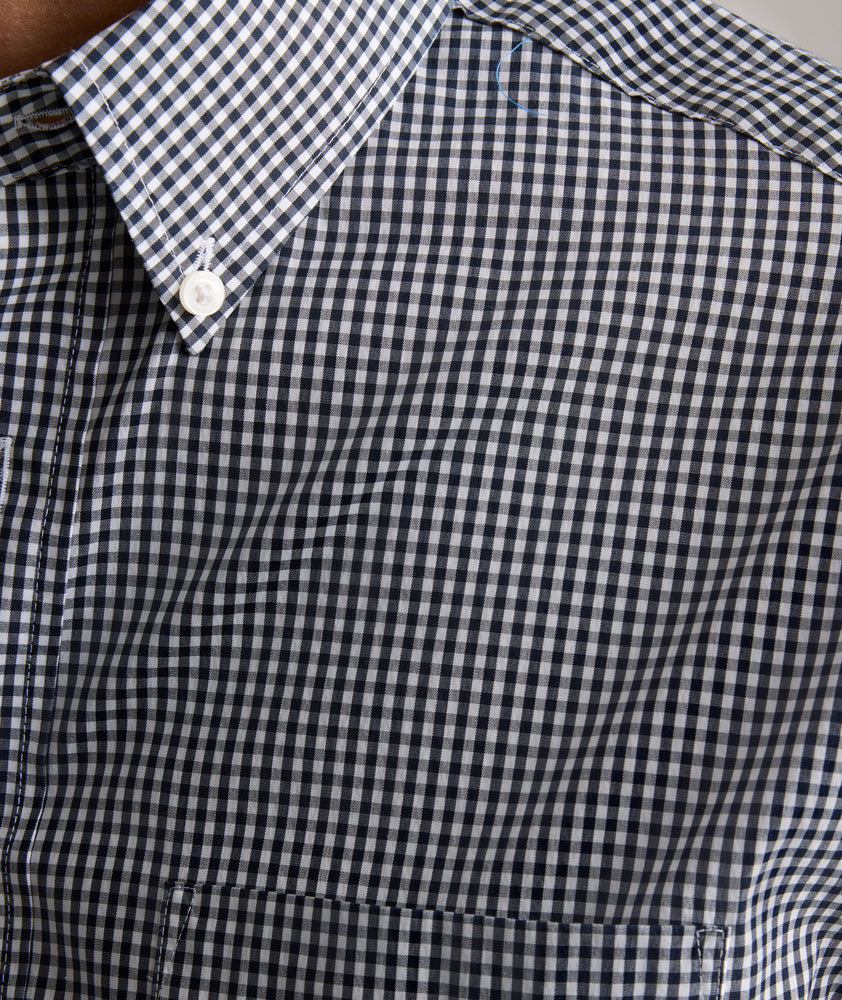 Model is wearing UNTUCKit CottonTek Harland Shirt in navy. 