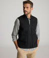 Model is wearing UNTUCKit Harper vest in black. 