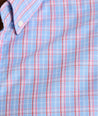 Model is wearing UNTUCKit Harrington wrinkle-free plaid blue shirt. 