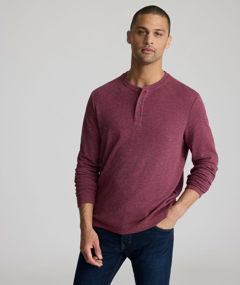 Model is wearing UNTUCKit Harrow Herringbone Henley in Tawny Port.