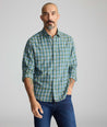 Model is wearing UNTUCKit Ultrasoft Flannel Shirt in Green & Brown Plaid. 