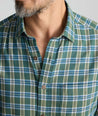 Model is wearing UNTUCKit Ultrasoft Flannel Shirt in Green & Brown Plaid. 