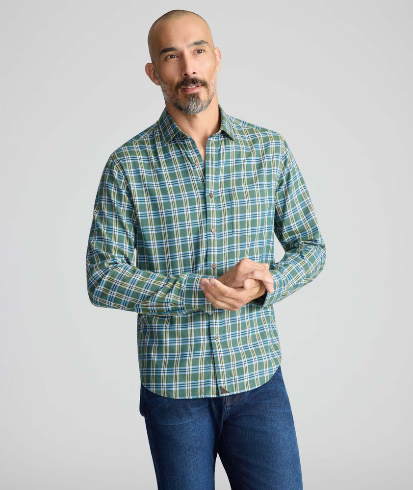Model is wearing UNTUCKit Ultrasoft Flannel Shirt in Green & Brown Plaid. 