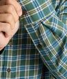 Model is wearing UNTUCKit Ultrasoft Flannel Shirt in Green & Brown Plaid. 