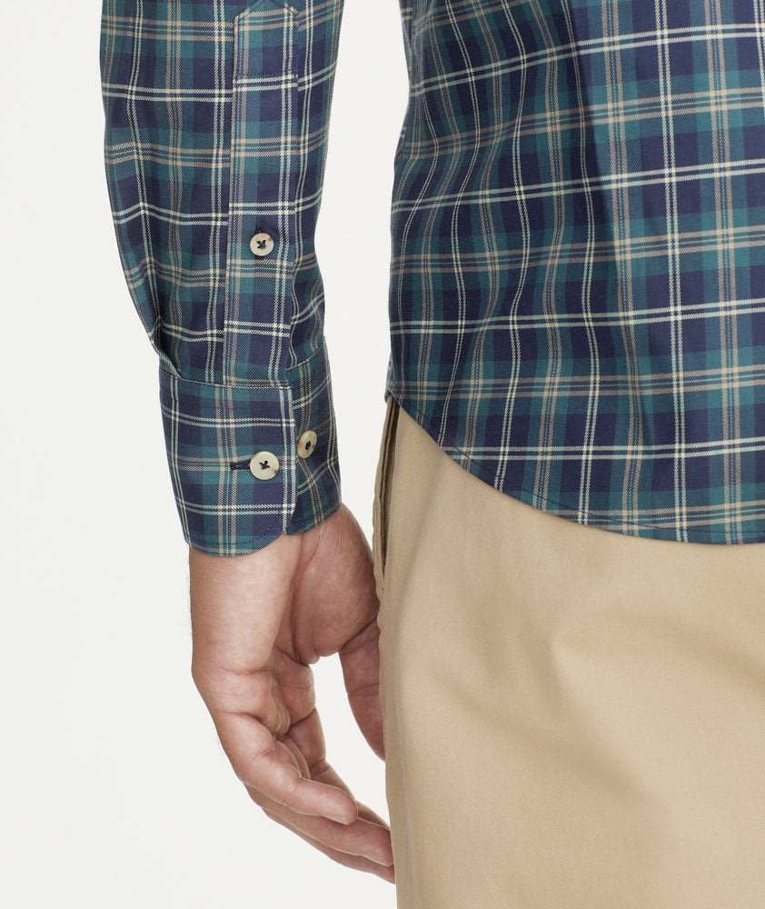 Model is wearing UNTUCKit Wrinkle-Free Harwin Shirt in Navy & Gold Multi Plaid.