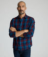 Model is wearing UNTUCKit Heinrich flannel in plaid blue. 