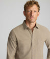 Model is wearing UNTUCKit Hemsworth in brown. 
