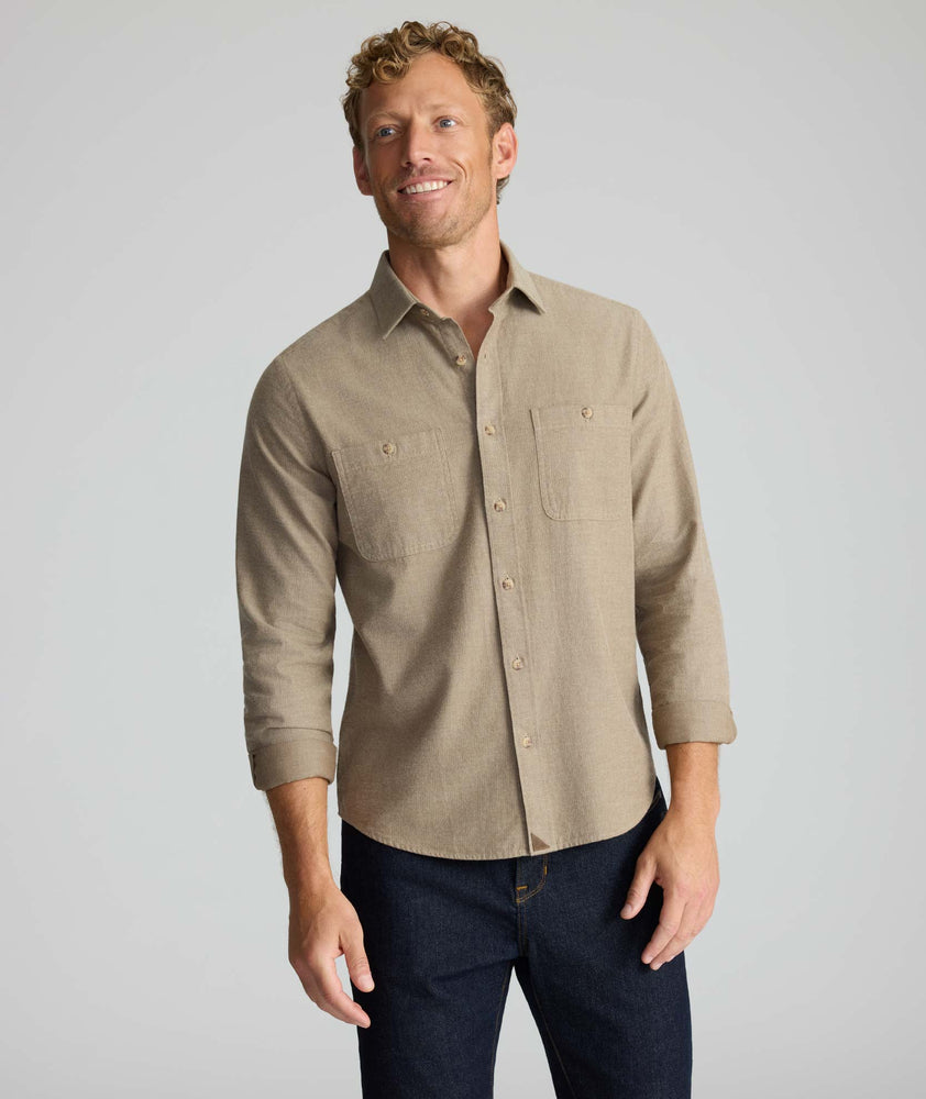 Model is wearing UNTUCKit Hemsworth in brown. 