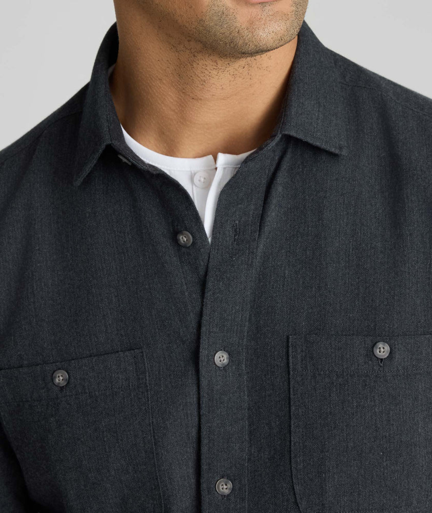 Model is wearing UNTUCKit Flannel Hemsworth Shirt in Deep Gray Herringbone.