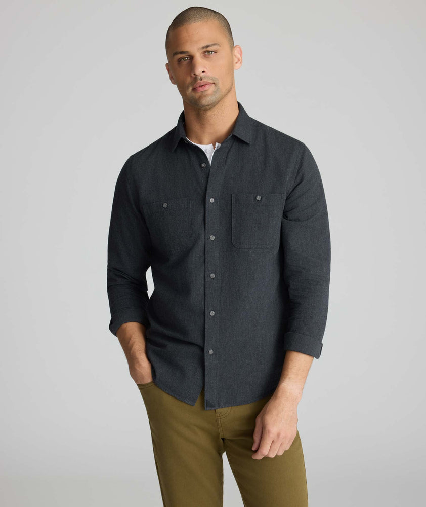Model is wearing UNTUCKit Flannel Hemsworth Shirt in Deep Gray Herringbone.