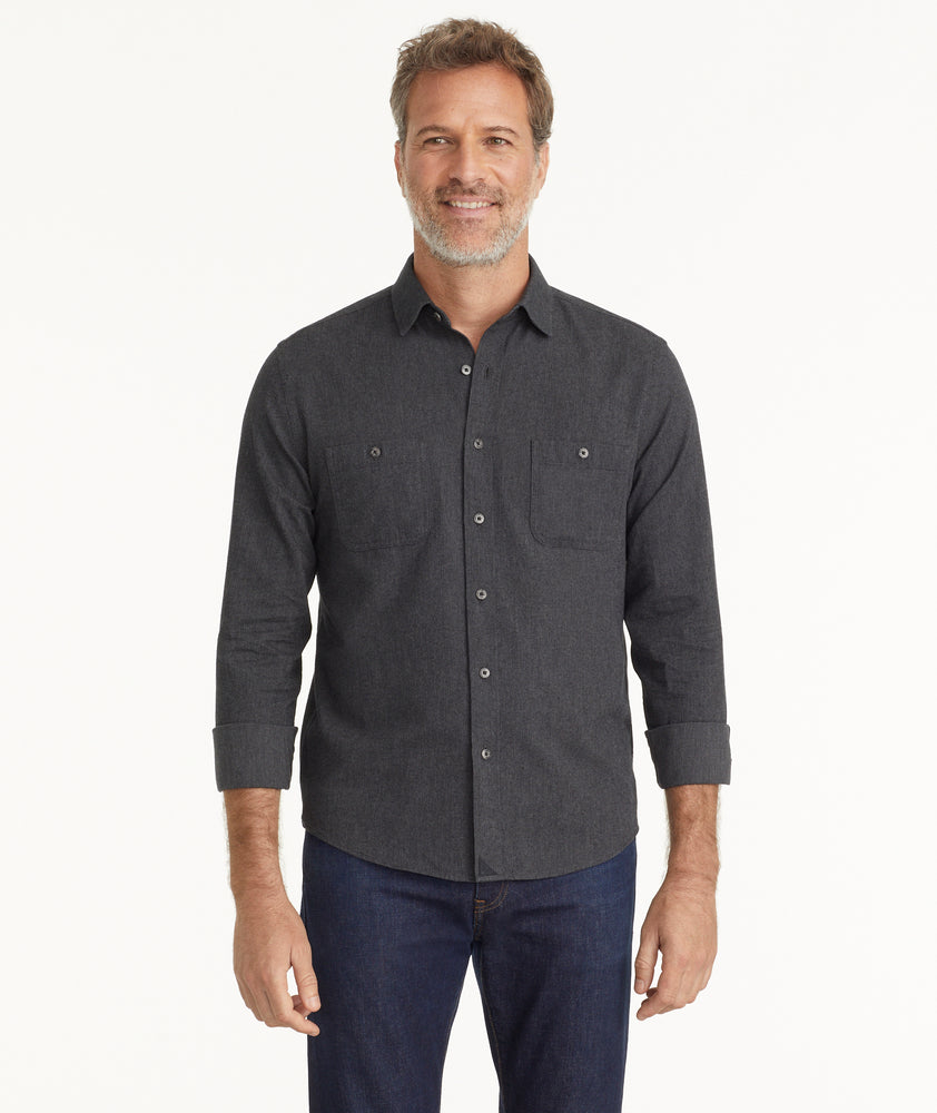 Model is wearing UNTUCKit Flannel Hemsworth Shirt in Deep Gray Herringbone.