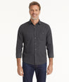 Model is wearing UNTUCKit Flannel Hemsworth Shirt in Deep Gray Herringbone.